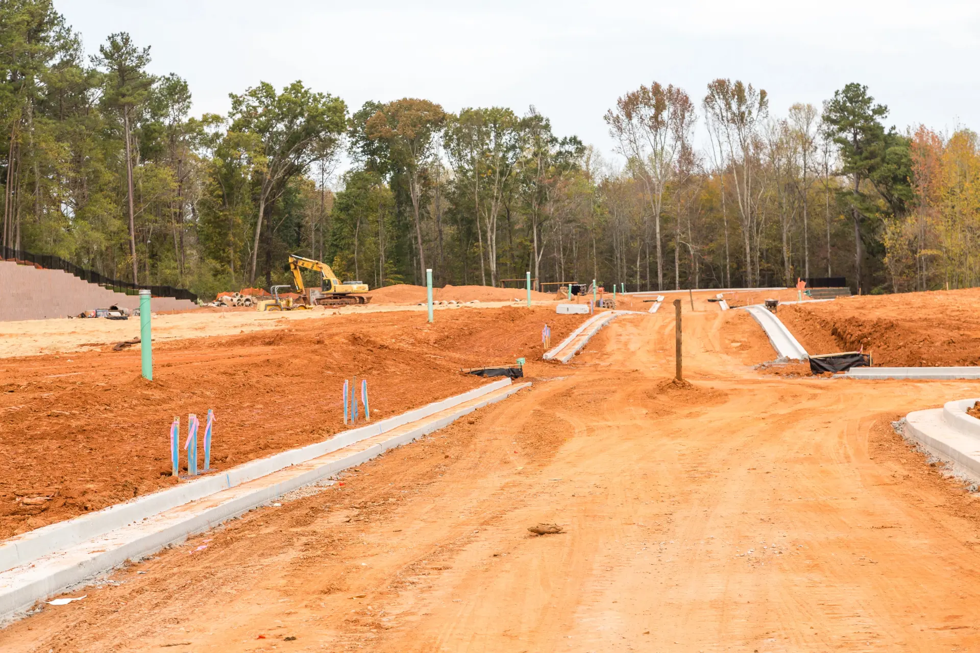 Graded roads and machine curb in a subdivision under construction